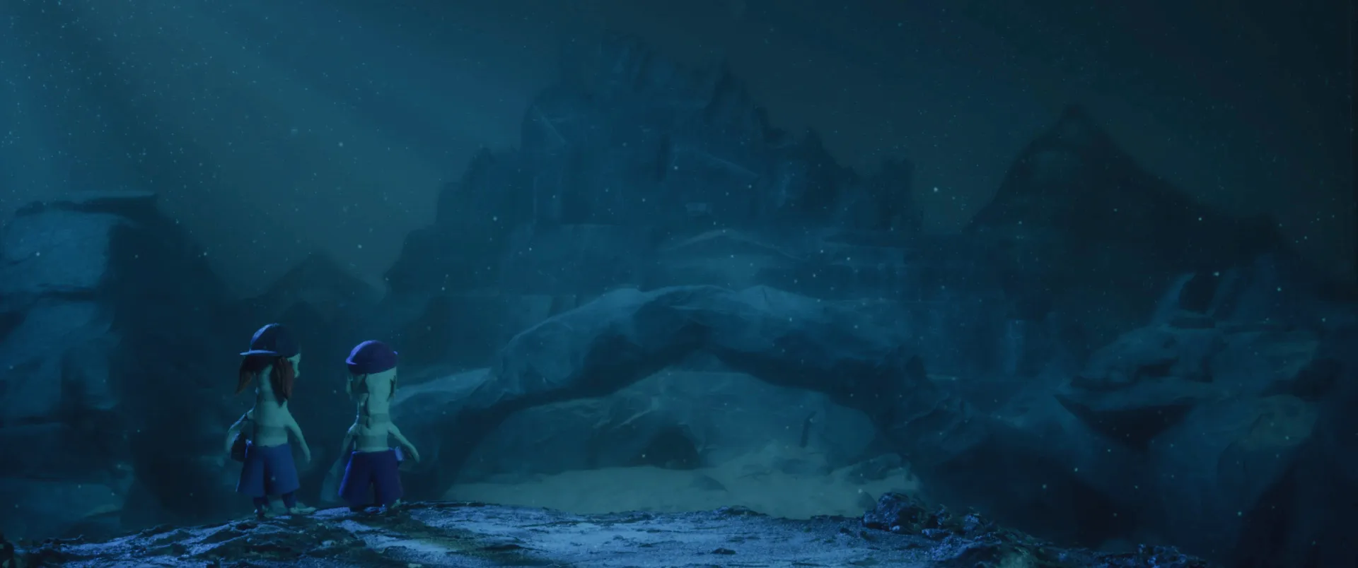 Fish&Trips Still image: Two fish-like creatures stand on a cliff under water with beer cans in their fins and look through the rocky, murky underwater landscape towards a cave in a rock.